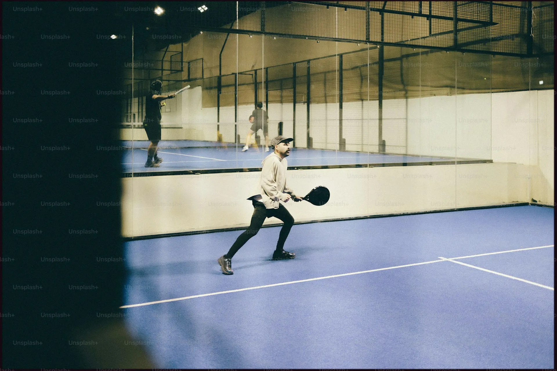 Players of different levels on padel court