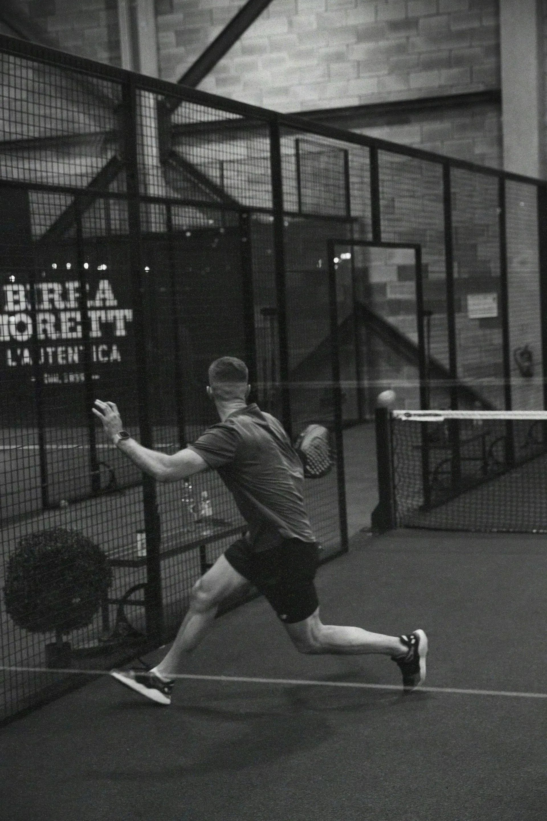 Padel player in action on court